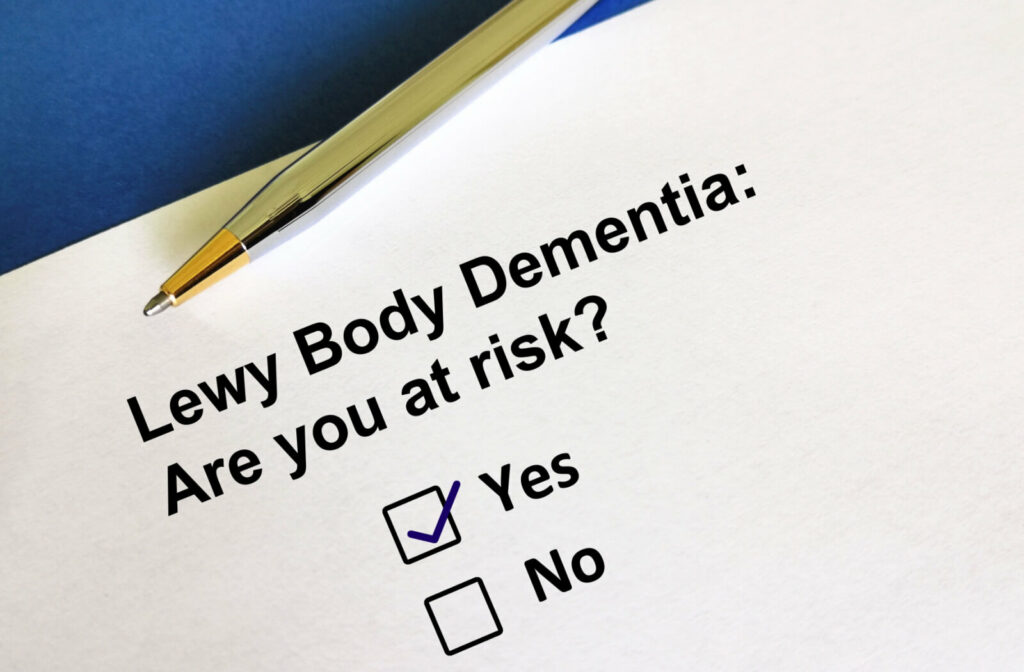 A written word on white paper, a question asking "Are you at risk of Lewy Body Dementia?"